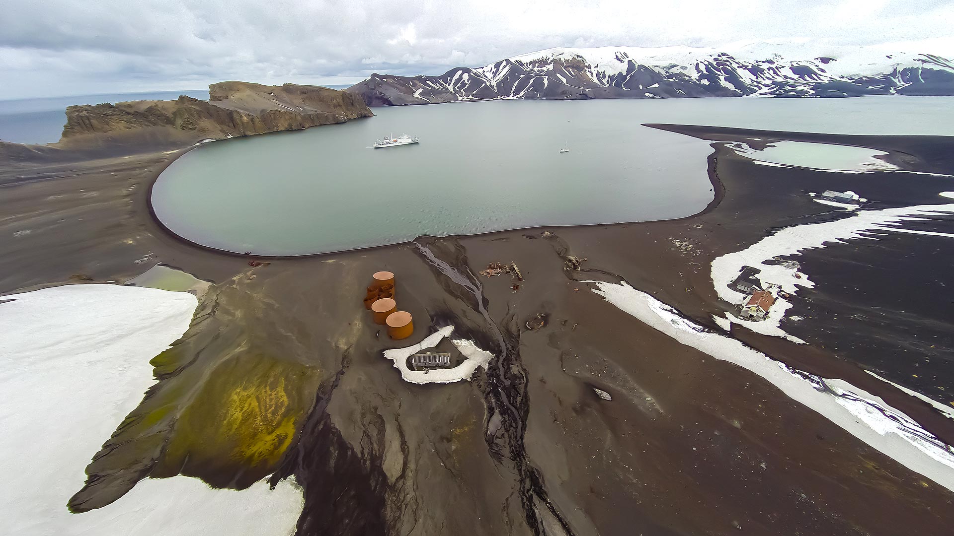 ... whose flooded caldera provides the safest mooring in the region.